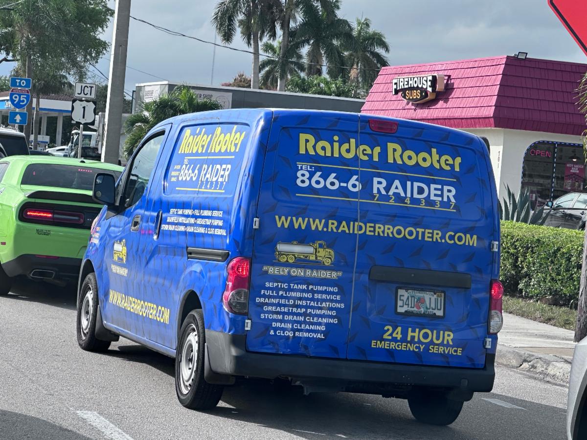 Raider Rooter van on the road as a plumber in south Florida